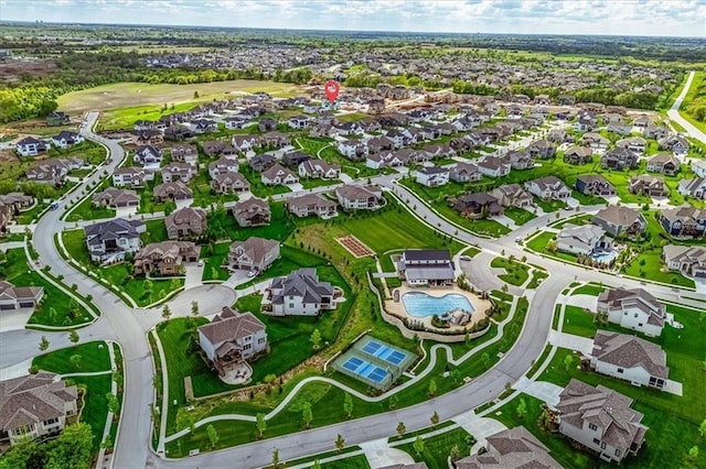 birds eye view of property with a residential view
