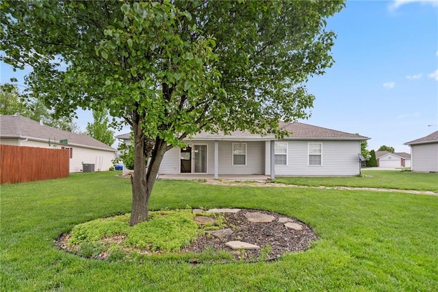 back of house with a yard, fence, and a patio area