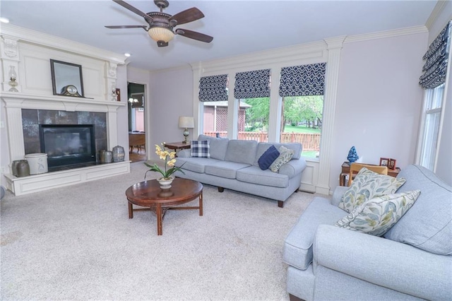 17065 W 162nd St, Olathe, KS 66062 - living area featuring a tiled fireplace, carpet floors, ornamental molding, and ceiling fan