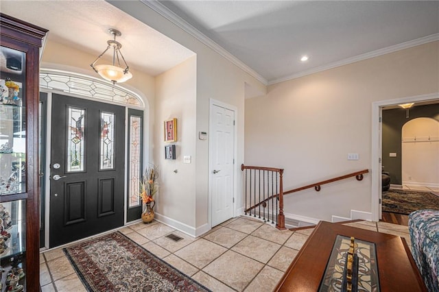 entryway with visible vents, ornamental molding, light tile patterned flooring, baseboards, and recessed lighting