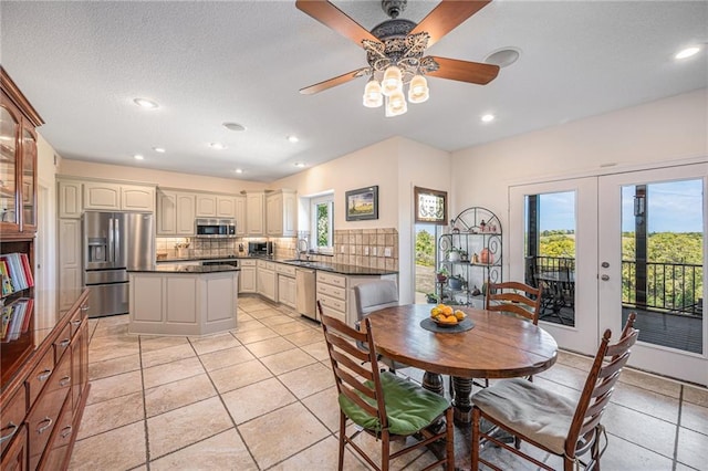 dining room with french doors, a ceiling fan, light tile patterned floors, and recessed lighting