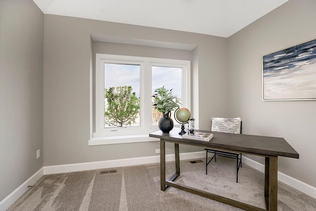 carpeted office with baseboards and visible vents