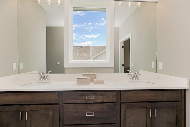 full bathroom featuring a sink and double vanity