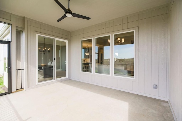unfurnished sunroom with a notable chandelier
