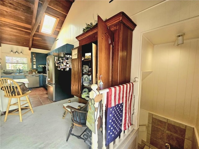 interior space with lofted ceiling with skylight and wooden ceiling