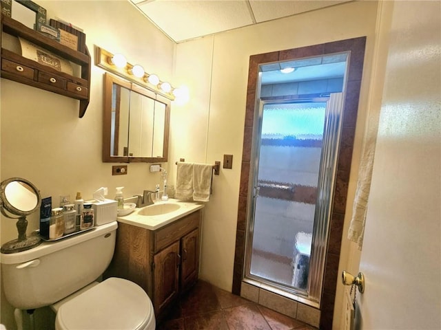 bathroom featuring toilet, tile patterned floors, and vanity
