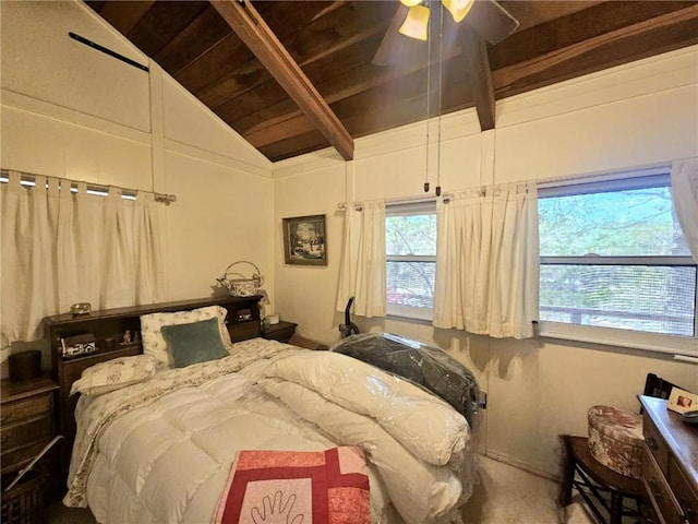 bedroom featuring wood ceiling, multiple windows, lofted ceiling with beams, and a ceiling fan