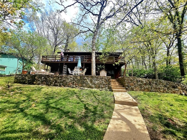 view of yard featuring a wooden deck and stairs