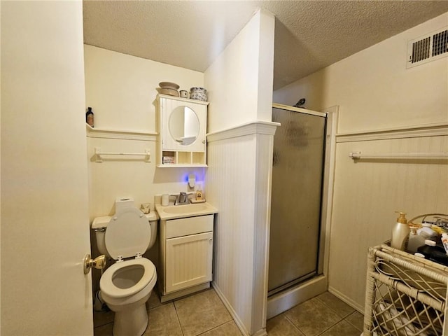 full bath featuring tile patterned flooring, a stall shower, toilet, and visible vents