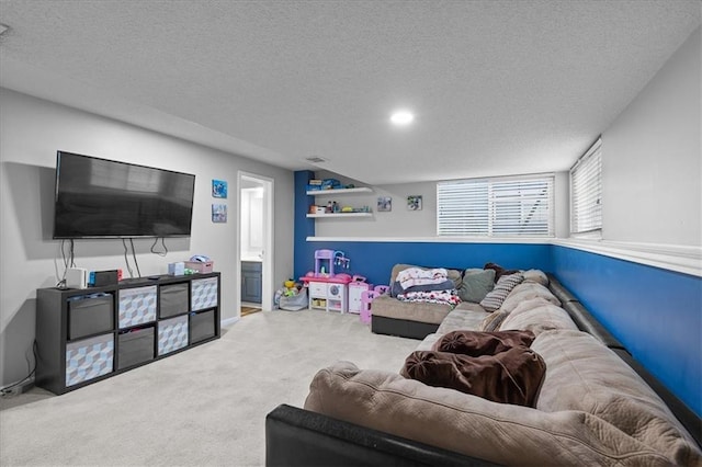 carpeted living room featuring a textured ceiling