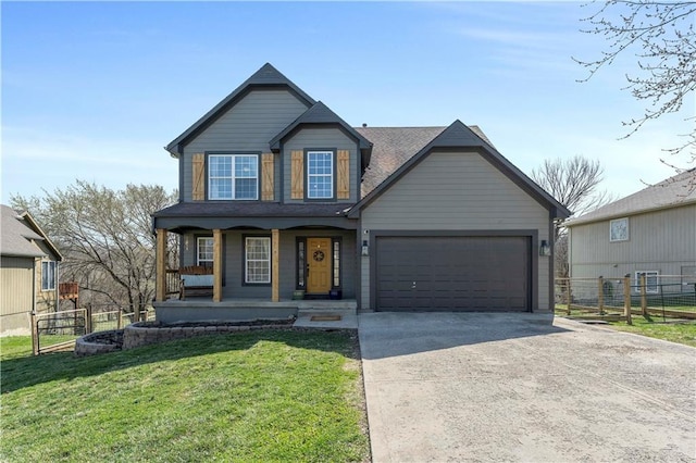 view of front of home with a garage, fence, covered porch, a front yard, and driveway