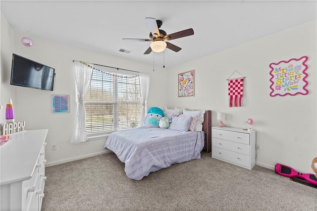 bedroom featuring light colored carpet, a ceiling fan, baseboards, and visible vents