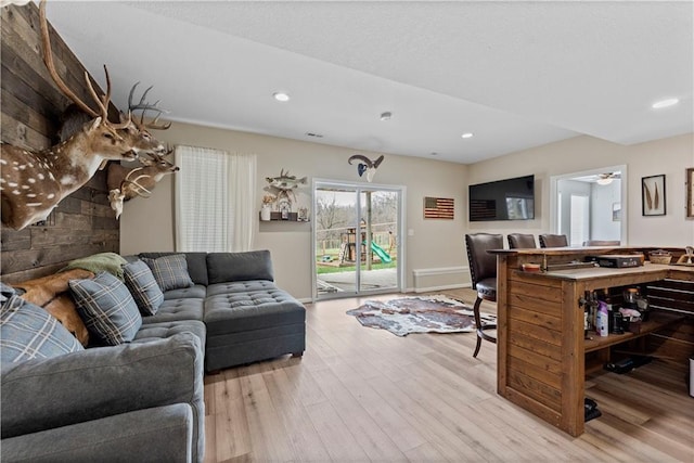 living room featuring recessed lighting and wood finished floors