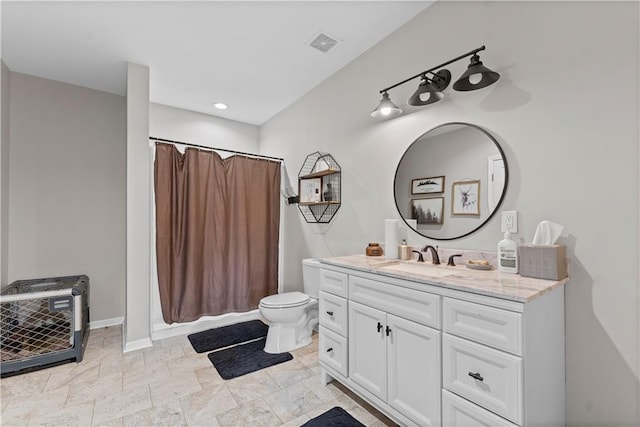 full bathroom with vanity, toilet, curtained shower, and visible vents