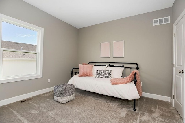 bedroom featuring baseboards and carpet floors