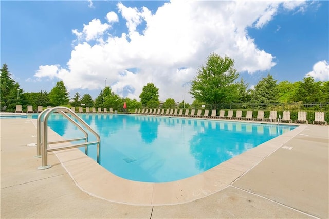 community pool featuring fence