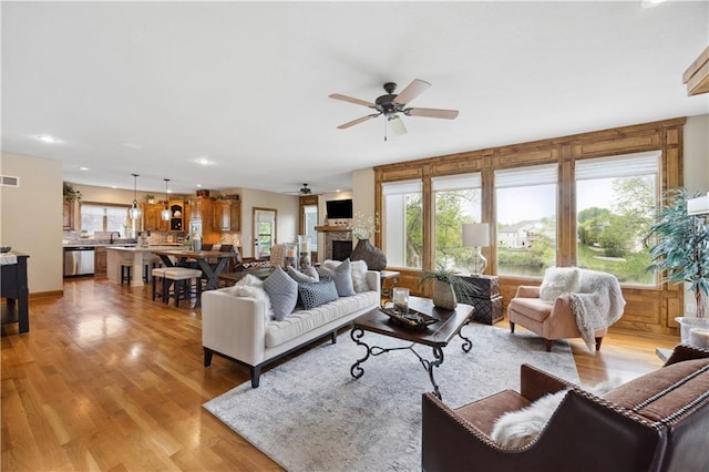 9924 Skyview Ln, Lenexa, KS 66220 - living area featuring ceiling fan, light wood-style floors, recessed lighting, and a fireplace