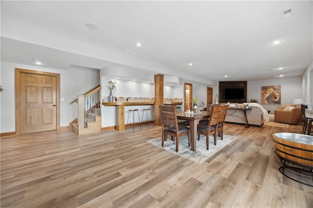 9924 Skyview Ln, Lenexa, KS 66220 - dining room featuring stairs, wood finished floors, recessed lighting, and baseboards