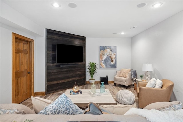 9924 Skyview Ln, Lenexa, KS 66220 - living room with wood finished floors, recessed lighting, and baseboards