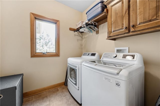 9924 Skyview Ln, Lenexa, KS 66220 - washroom with washer and dryer, baseboards, cabinet space, and light tile patterned floors