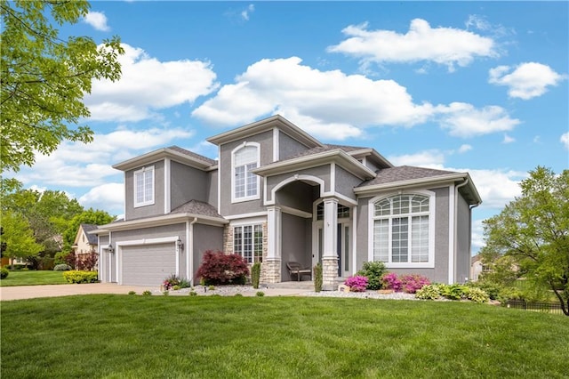 9924 Skyview Ln, Lenexa, KS 66220 - view of front of home featuring a garage, a front yard, stucco siding, and driveway