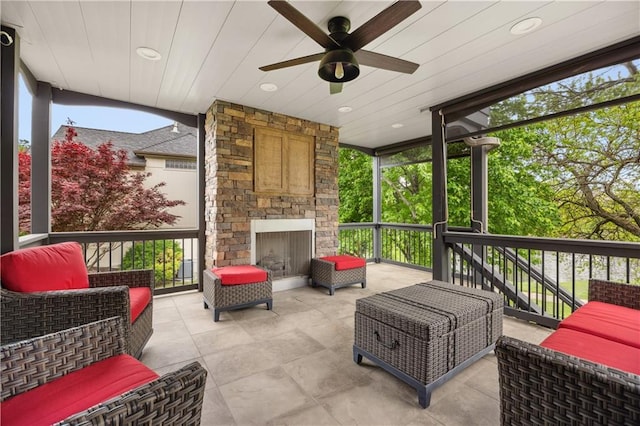 9924 Skyview Ln, Lenexa, KS 66220 - sunroom with ceiling fan, healthy amount of natural light, and an outdoor living space with a fireplace