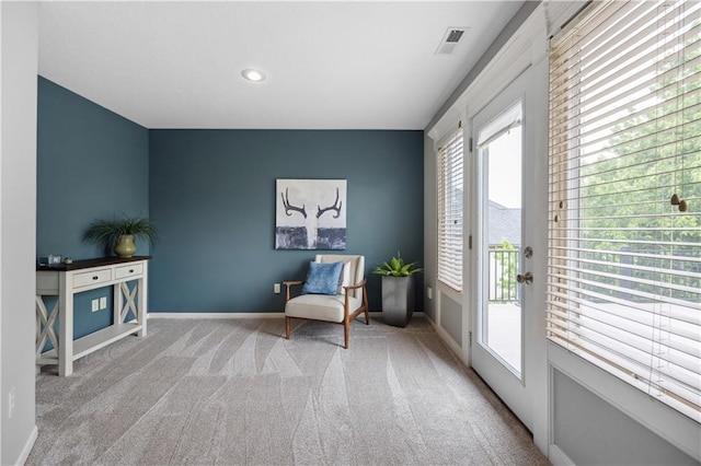 9924 Skyview Ln, Lenexa, KS 66220 - living area with carpet floors, baseboards, an accent wall, and recessed lighting