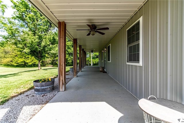 view of patio / terrace featuring ceiling fan and an attached carport