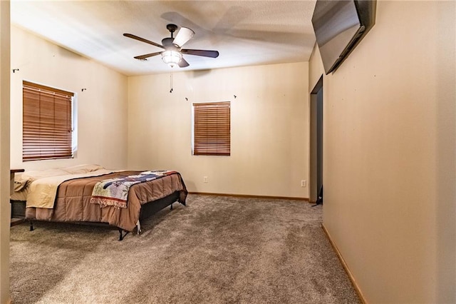 bedroom with carpet floors, baseboards, and ceiling fan