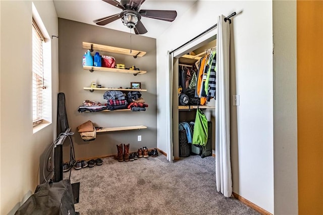spacious closet featuring carpet and a ceiling fan