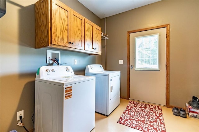 laundry area featuring cabinet space and washer and dryer