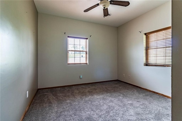 empty room featuring carpet flooring, ceiling fan, and baseboards