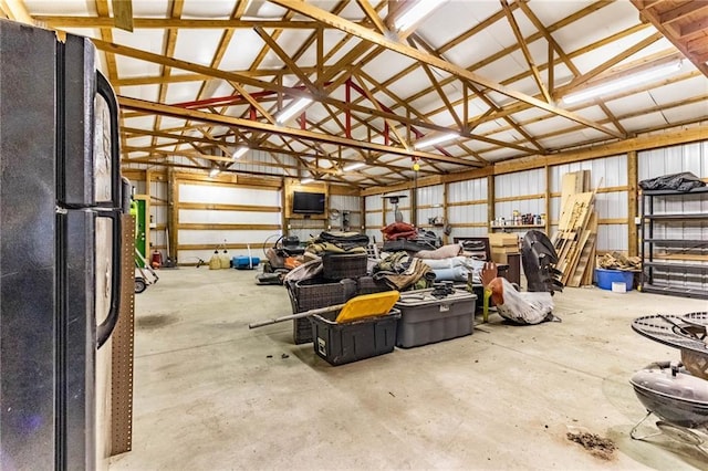 garage with freestanding refrigerator