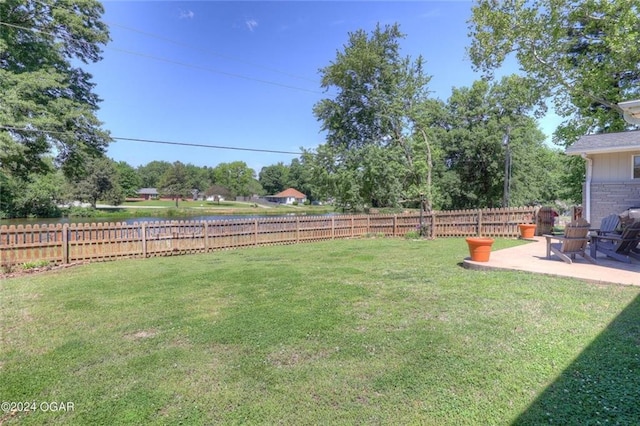 view of yard with a patio and a fenced backyard