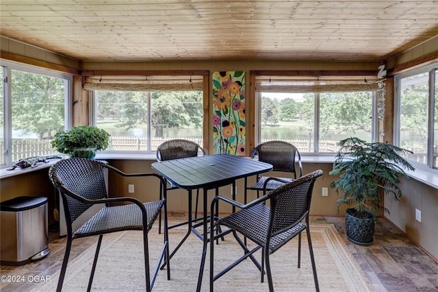sunroom / solarium with wooden walls and wood ceiling