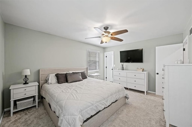 bedroom with baseboards, a ceiling fan, and carpet