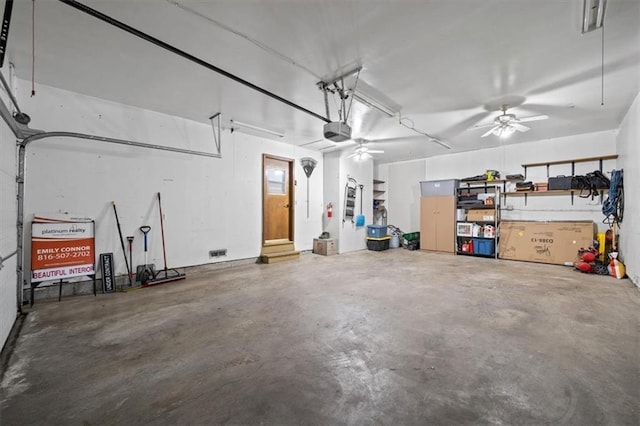 garage with ceiling fan and a garage door opener