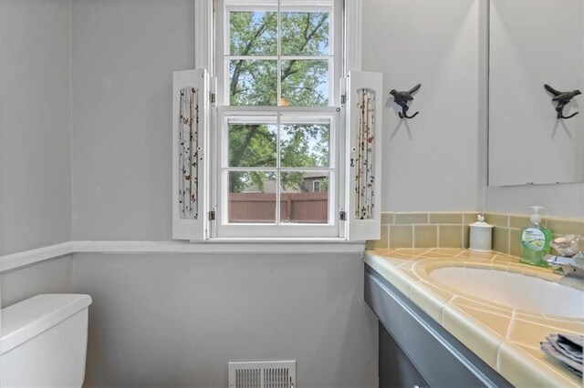 9817 Cedar St, Overland Park, KS 66207 - half bathroom with toilet and vanity