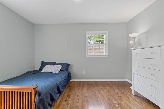9817 Cedar St, Overland Park, KS 66207 - bedroom with wood finished floors and baseboards