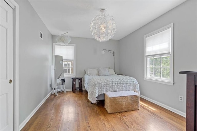 9817 Cedar St, Overland Park, KS 66207 - bedroom with wood finished floors and baseboards