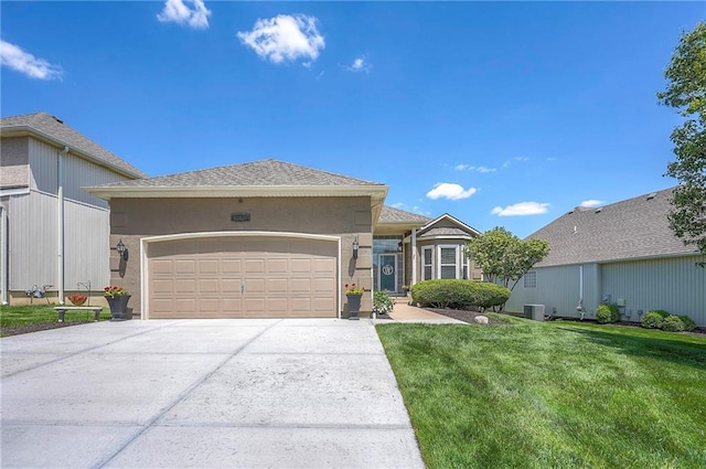 single story home featuring cooling unit, a garage, stucco siding, concrete driveway, and a front yard