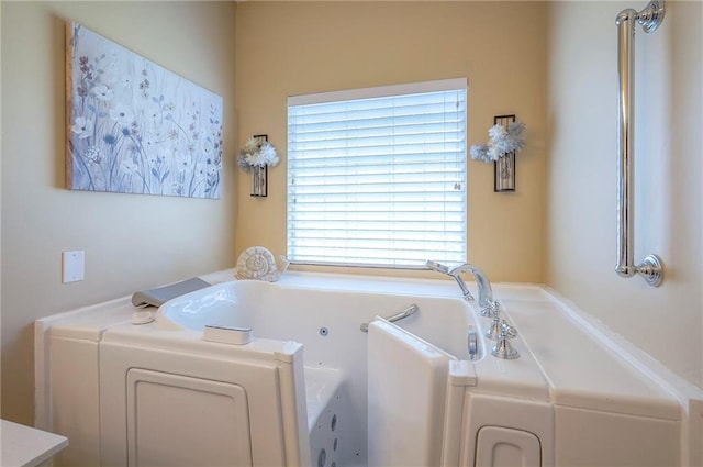 full bathroom featuring a whirlpool tub