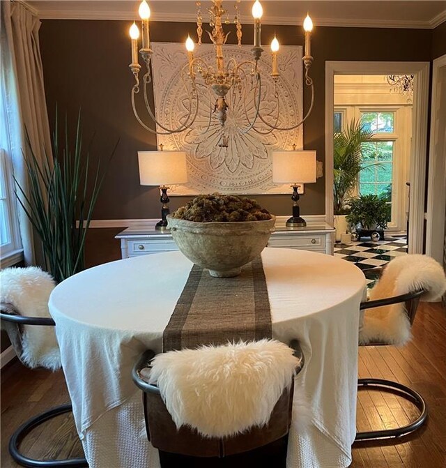6116 W 61st Ter, Mission, KS 66202 - dining space featuring wood-type flooring, crown molding, and a chandelier