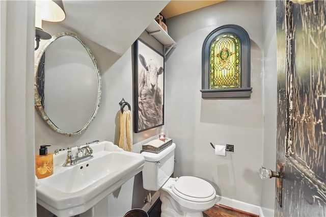 6116 W 61st Ter, Mission, KS 66202 - bathroom with a sink, toilet, baseboards, and wood finished floors
