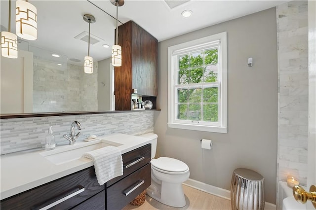 6116 W 61st Ter, Mission, KS 66202 - full bathroom with a shower, decorative backsplash, vanity, baseboards, and toilet