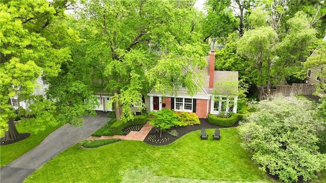 6116 W 61st Ter, Mission, KS 66202 - view of front of house featuring a chimney, brick siding, and asphalt driveway