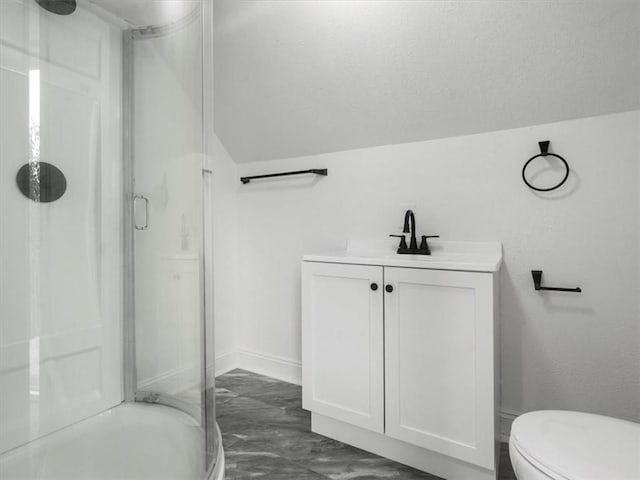 full bathroom with vaulted ceiling, vanity, a stall shower, and toilet