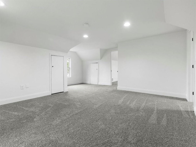 bonus room with baseboards, carpet flooring, recessed lighting, and lofted ceiling
