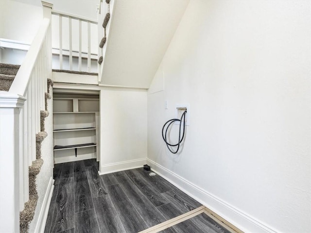 stairs featuring baseboards and wood finished floors