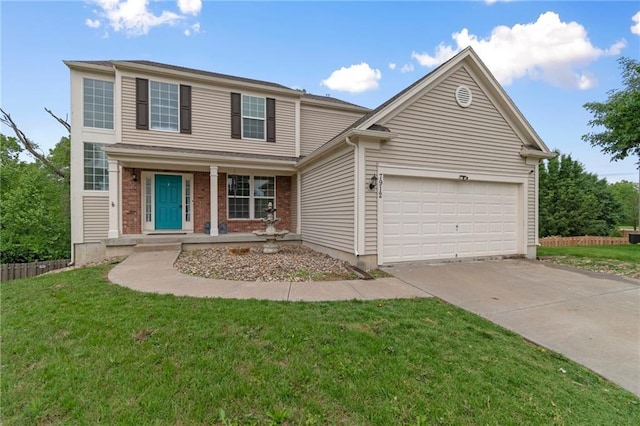 7912 N Poplar Ct, Kansas City, MO 64119 - traditional home featuring concrete driveway, an attached garage, a porch, and a front lawn
